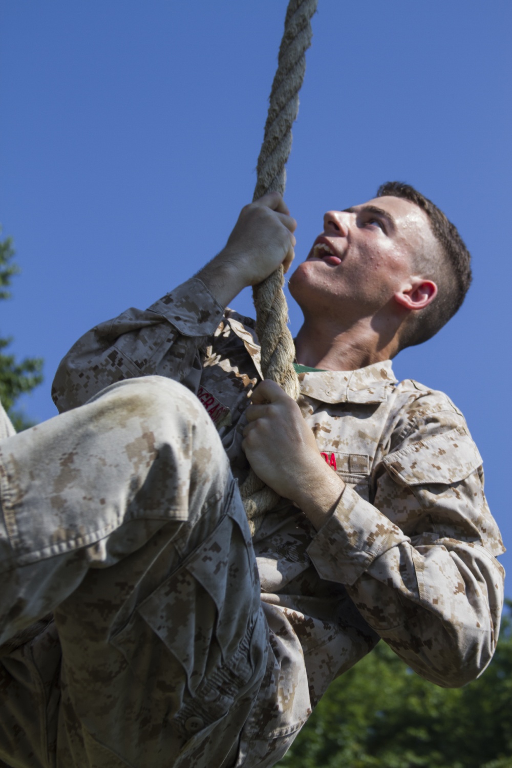 A participant in the 2017 Summer Leadership and Character Development Academy (SLCDA) climbs a rope as part of the Leadership Reaction Course July 19 on Marine Corps Base Quantico, Va. The SLCDA is a weeklong summer program designed to prepare rising high school juniors and seniors for college by introducing them to Marine Corps skills, ethics, character development and camaraderie.