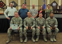 Winners of the fourth quarter Wing Quarterly Awards pose for a photo at the Grizzly Bend Jan. 24, 2018, at Malmstrom Air Force Base, Mont. Pictured from left to right in the back row: Kenneth Sylva, 341st Mission Support Group, Civilian Category II Supervisor of the Quarter; Kenneth Sanders, 341st MSG, Civilian Category I Supervisor of the Quarter; Michael Hryszko, 341st Medical Group, Volunteer of the Quarter; Brittany Vallejo, 341 Maintenance Group, Spouse of the Quarter; and Shanna Guillen, 341st MXG, Civilian Category I of the Quarter. Front row: Airman 1st Class Brandon Cummings, representing Dorm 742, Dormitory of the Quarter; Airman 1st Class Eric Sprouse, 341st MDG, Airman of the Quarter; Tech. Sgt. Geoffrey Hamilton, 341st Operations Group, Noncommissioned Officer of the Quarter; and 2nd Lt. Kalon Baker, 341st MXG, Company Grade Officer of the Quarter. Other winners not pictured were Airman 1st Class Katy Wagge, 341st Security Forces Group, Dorm Room of the Quarter; Airman 1st Class Vincent DeConto, 341st SFG, Honor Guard of the Quarter; Master Sgt. Tiffany Sargent, 341st MSG, Senior NCO of the Quarter; and Maj. William Gripp, 341st SFG, Field Grade Officer of the Quarter. The 341st Missile Maintenance Squadron Missile Communications Section was the Professional Team of the Quarter. (U.S. Air Force photo by John Turner)