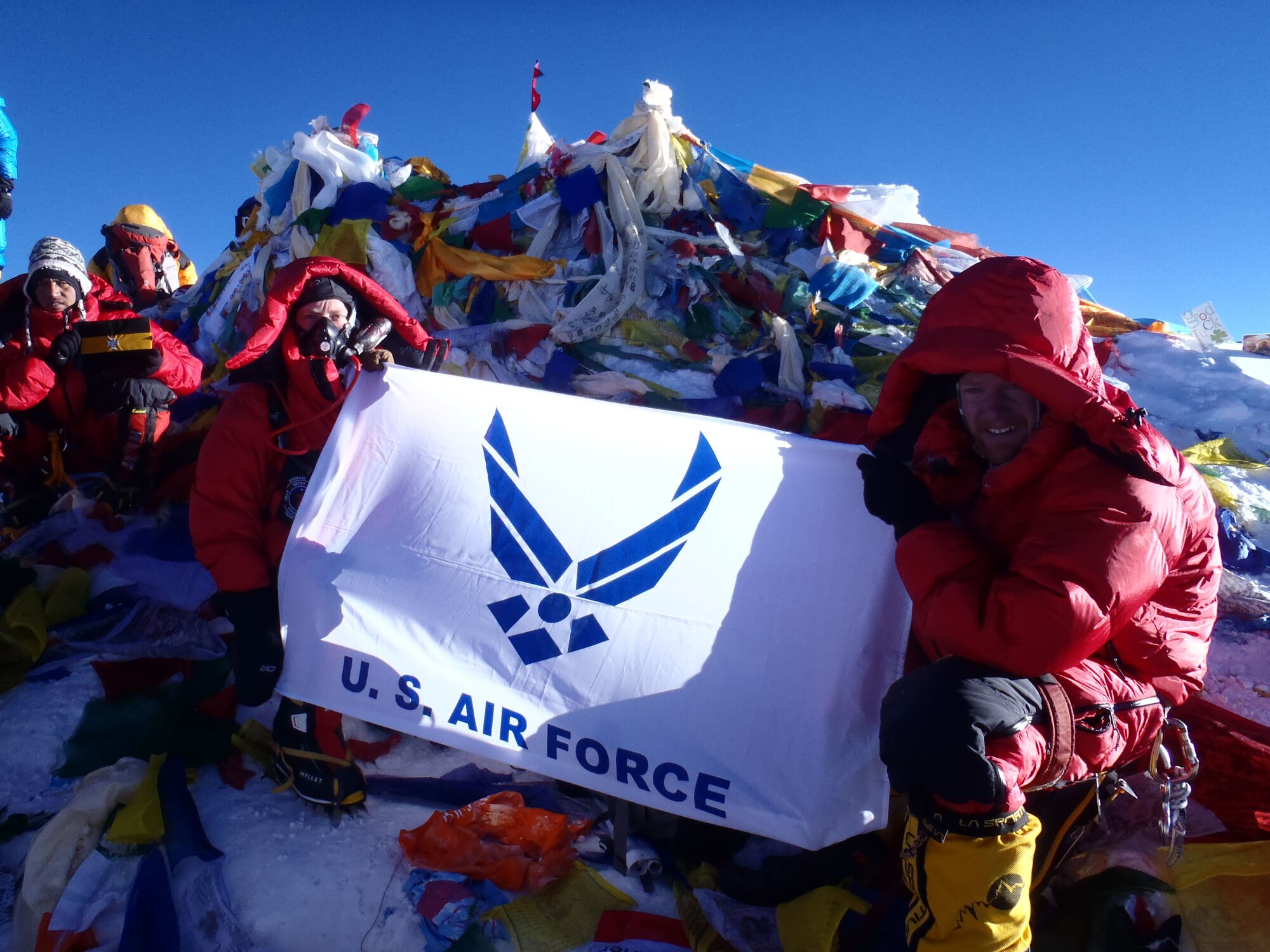 Lt. Col. Robert Marshall, left, Center for Character and Leadership Development director for experiential education programs and honor education, poses for a photo with the Air Force flag May 20, 2013, at the summit of Mt. Everest. Marshall was one of the primary leads for the Air Force Seven Summits team that traveled the world and climbed the highest peaks on each continent. (Courtesy photo)