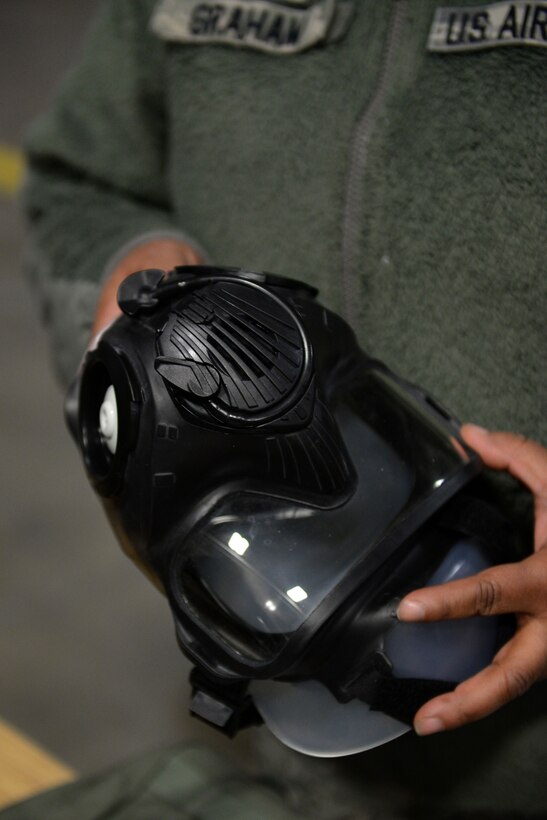 Tech. Sgt. Surnicke Graham, noncommissioned officer in charge of the 673d Logistics Readiness Squadron Individual Protective Equipment Element, inspects a Joint Service General Purpose Mask (JSGPM) M50, Jan. 17, 2018, at Joint Base Elmendorf-Richardson, Alaska. The 673d LRS/IPE is responsible for inspecting all Chemical, Biological, Radiological, and Nuclear IPE.