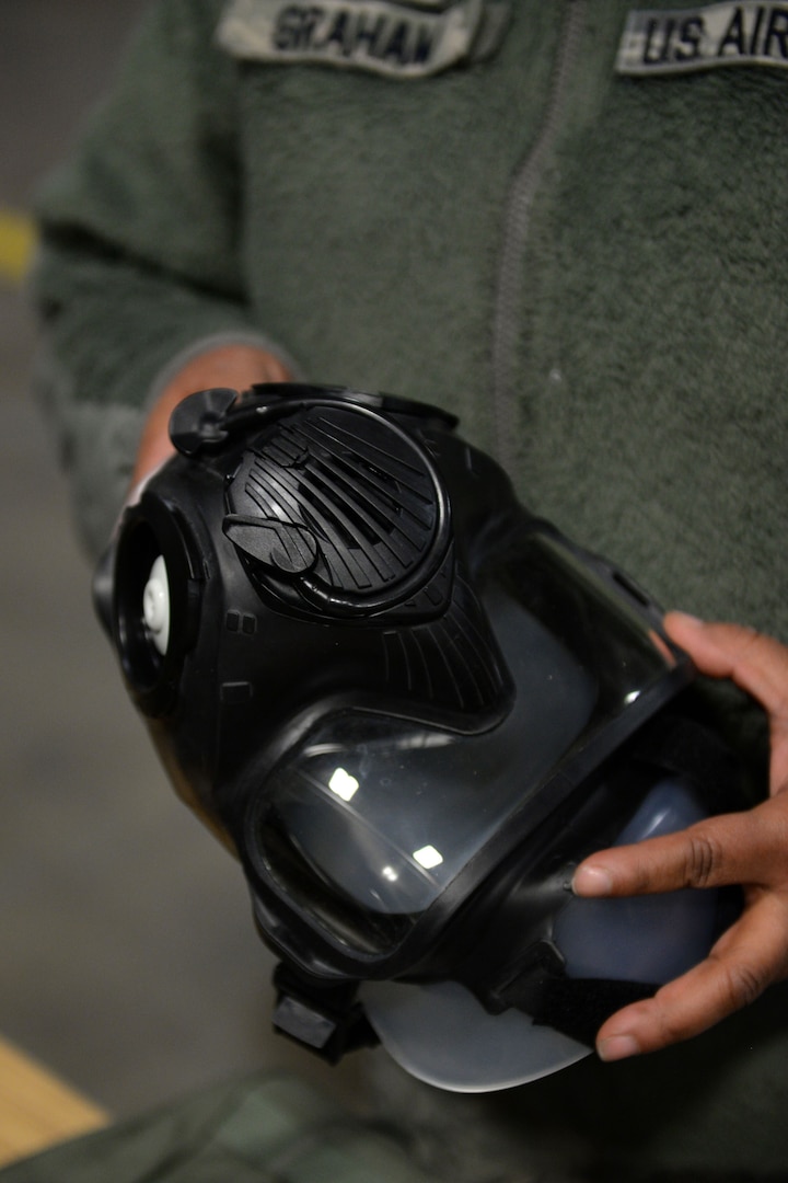 Tech. Sgt. Surnicke Graham, noncommissioned officer in charge of the 673d Logistics Readiness Squadron Individual Protective Equipment Element, inspects a Joint Service General Purpose Mask (JSGPM) M50, Jan. 17, 2018, at Joint Base Elmendorf-Richardson, Alaska. The 673d LRS/IPE is responsible for inspecting all Chemical, Biological, Radiological, and Nuclear IPE.