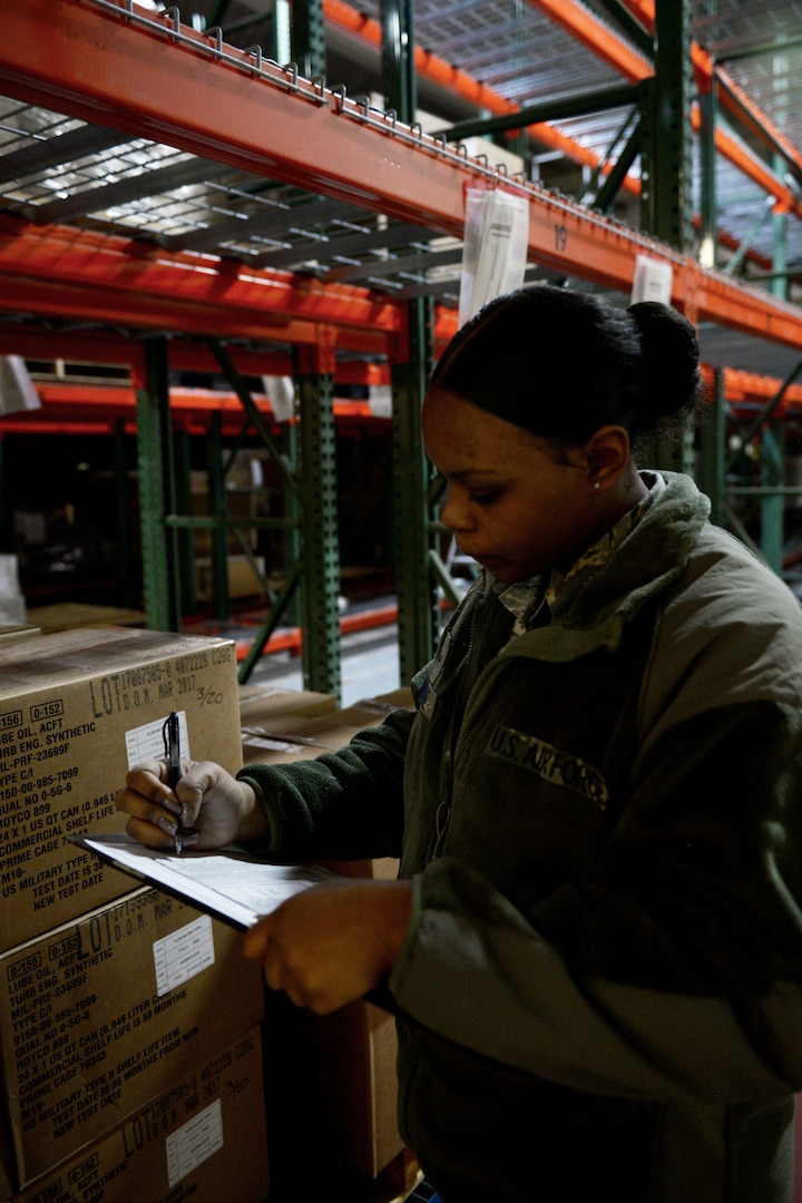 Airman 1st Class Nekail McAffee, 673d Logistics Readiness Squadron physical inventory journeyman, checks inventory to maintain accountability of products, Jan. 17, 2018, at Joint Base Elmendorf-Richardson, Alaska. The physical inventory element keeps accountability of all parts, pre-positioning them so when the aircraft needs them, they are ready for issue.
