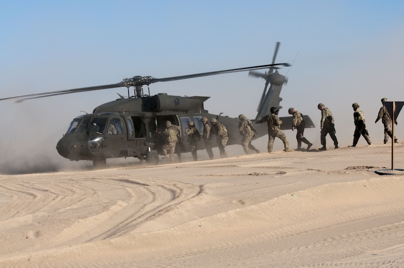 Soldiers from the 115th Signal Battalion, 160th Signal Brigade, 335th Signal Command, leave FOB Gerber at the Udairi Range Complex near Camp Buehring, Kuwait, Jan. 12, 2018, during an emergency deployment readiness exercise, or EDRE. The training event allowed the signal unit to practice their key tasks for a rapid deployment order.