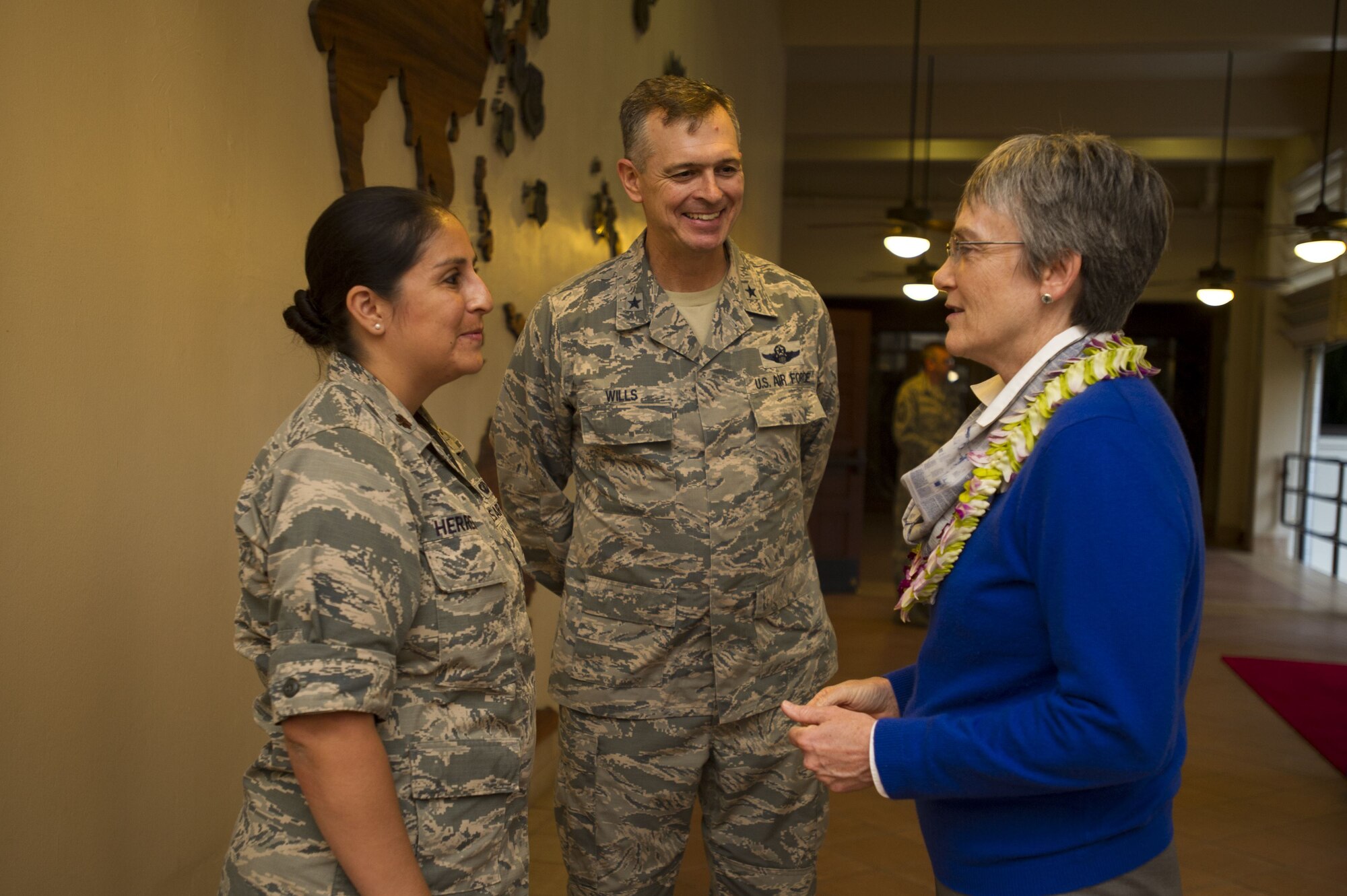 Secretary of the Air Force Heather Wilson speaks with Maj. Monica Herrera, Pacific Air Forces (PACAF) Strategy, Plans and Programs Australia country director (left), and Brig. Gen. Craig Wills, PACAF Strategy, Plans and Programs director (middle), following a theater overview briefing at PACAF headquarters, Joint Base Pearl Harbor-Hickam, Hawaii, Jan. 23, 2018.