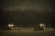 Airmen with the 374th Civil Engineer Squadron use snow plows to clear the runway of newly fallen snow, Jan. 22, 2018, at Yokota Air Base, Japan.