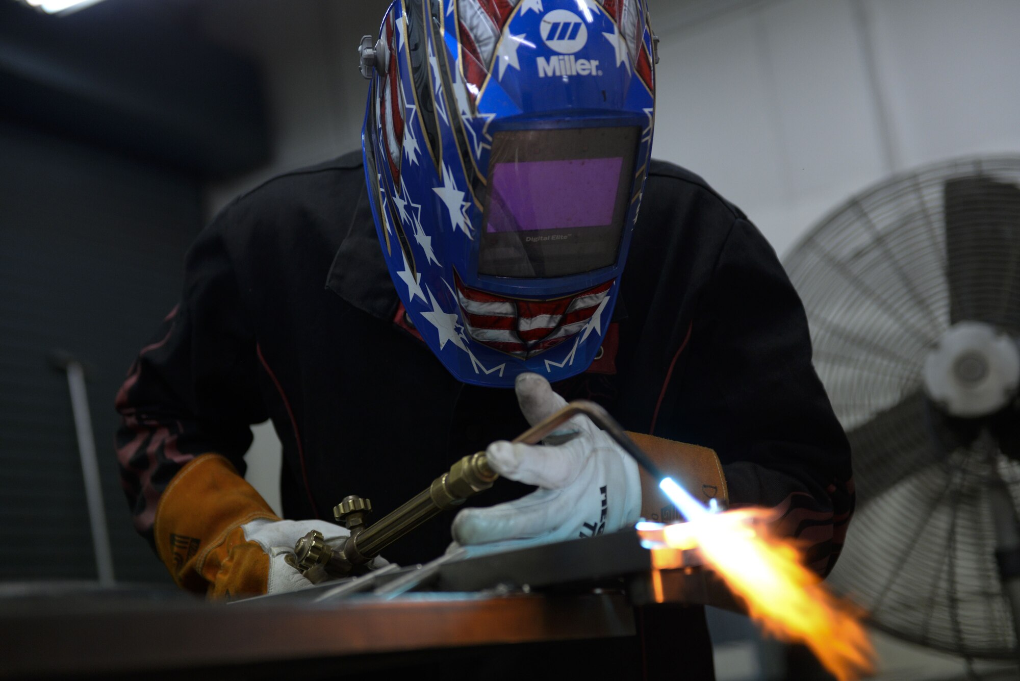 Senior Airman David Petrich, 374th Maintenance Squadron aircraft metals technology fabricator, works on a parachute rack, Jan. 24, 2018, at Yokota Air Base, Japan.