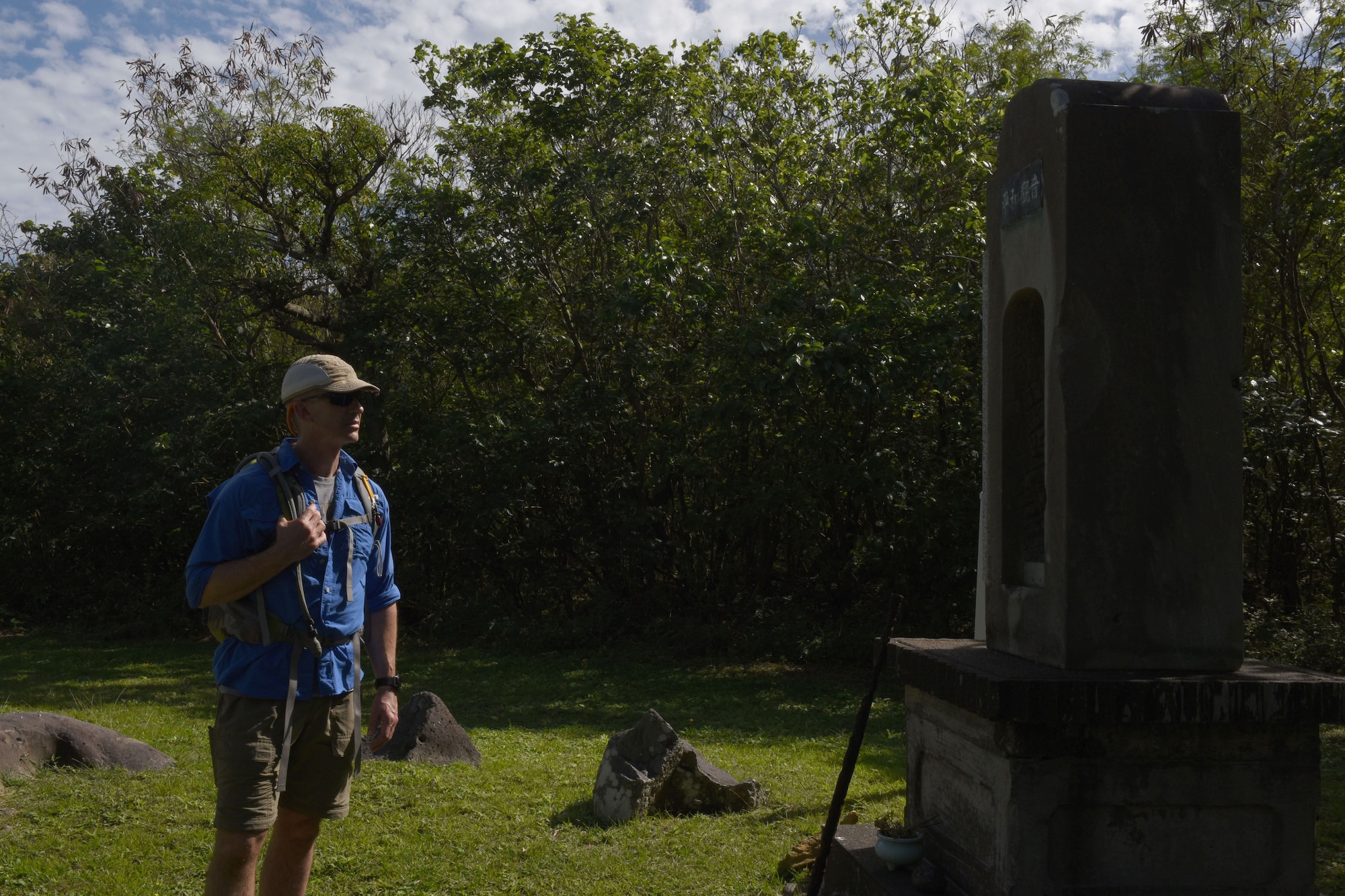 Senior Master Sgt. Jeremy Remley, U.S. Air Force Band of the Pacific band manager, reflects in front of a small shrine Jan. 24, 2017, on the island of Iwo To, Japan