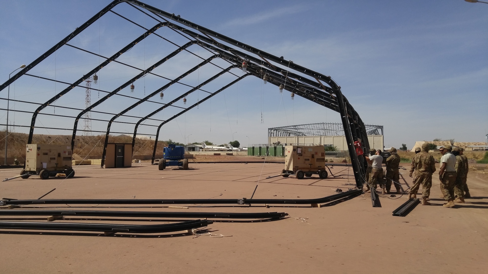 Airmen from the 635th Material Maintenance Squadron, Holloman Air Force Base, New Mexico, deployed to N'Djamena on Jan. 7, 2018 to assist the Chadian Air Force to erect aircraft maintenance shelters and training for their critical aircraft. The effort was initiated due to a large-scale wind storm last summer that destroyed many aircraft and maintenance shelters located in the main airfield in N'Djamena. (Courtesy Photo)