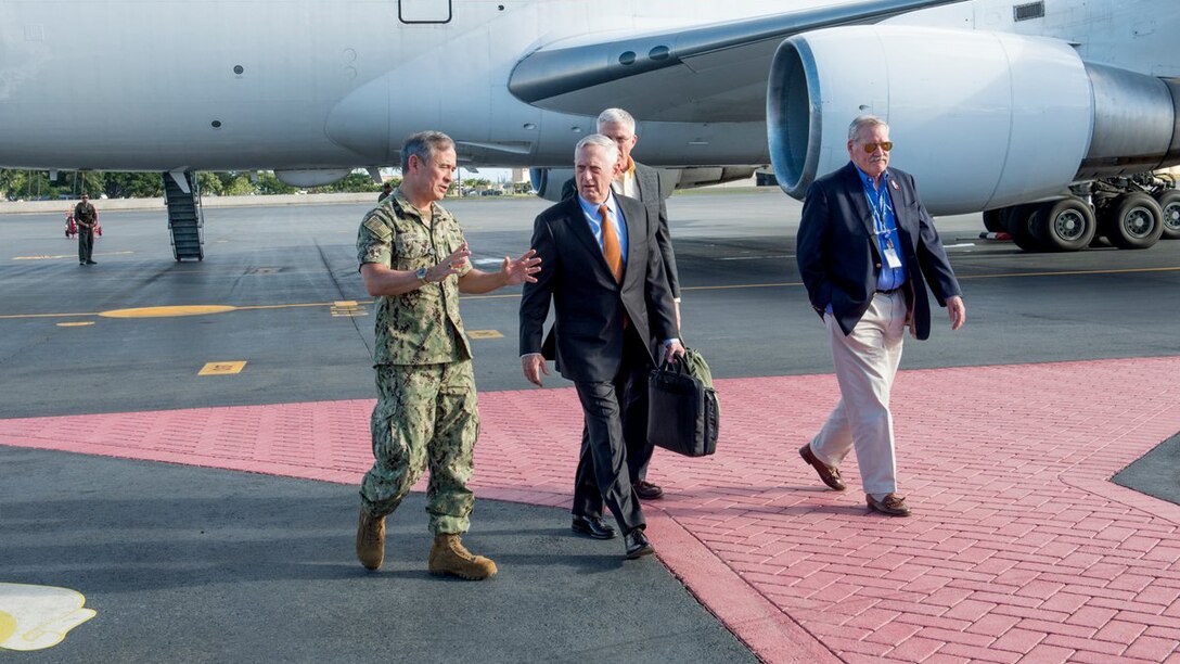 Defense Secretary James N. Mattis walks along the tarmac after arriving in Hawaii.