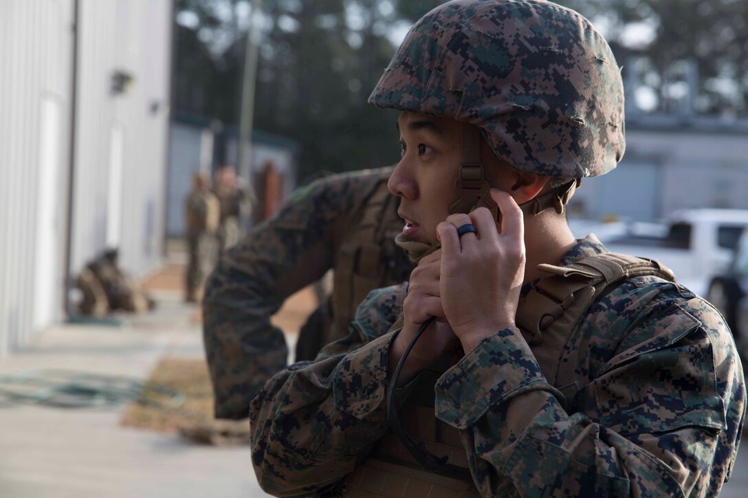 Petty Officer 3rd Class Marvin Almario with 2nd Medical Battalion, 2nd Marine Logistics Group, buckles his kevlar in preparation for a final test during a Tactical Combat Casualty Care training exercise at Camp Lejeune, N.C. Jan. 22, 2018. TCCC is designed to help corpsmen practice basic medical techniques while in a stressful environment. The corpsmen are evaluated with simulated battlefield scenarios overseen by instructors. (U.S. Marine Corps photo by Pfc. Nicholas Guevara)