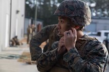Petty Officer 3rd Class Marvin Almario with 2nd Medical Battalion, 2nd Marine Logistics Group, buckles his kevlar in preparation for a final test during a Tactical Combat Casualty Care training exercise at Camp Lejeune, N.C. Jan. 22, 2018. TCCC is designed to help corpsmen practice basic medical techniques while in a stressful environment. The corpsmen are evaluated with simulated battlefield scenarios overseen by instructors. (U.S. Marine Corps photo by Pfc. Nicholas Guevara)