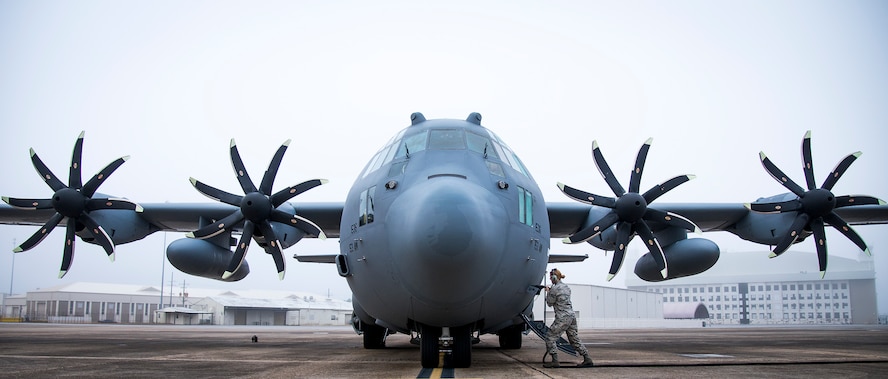 A 153rd Airlift Wing maintainer plugs in a generator cable into her C-130H Hercules after arriving at Eglin Air Force Base, Fla., Jan. 11, 2018. The Air Force’s first fully upgraded C-130H is here for test and evaluation on its new modified propeller system and engines. (U.S. Air Force photo by Samuel King Jr.)