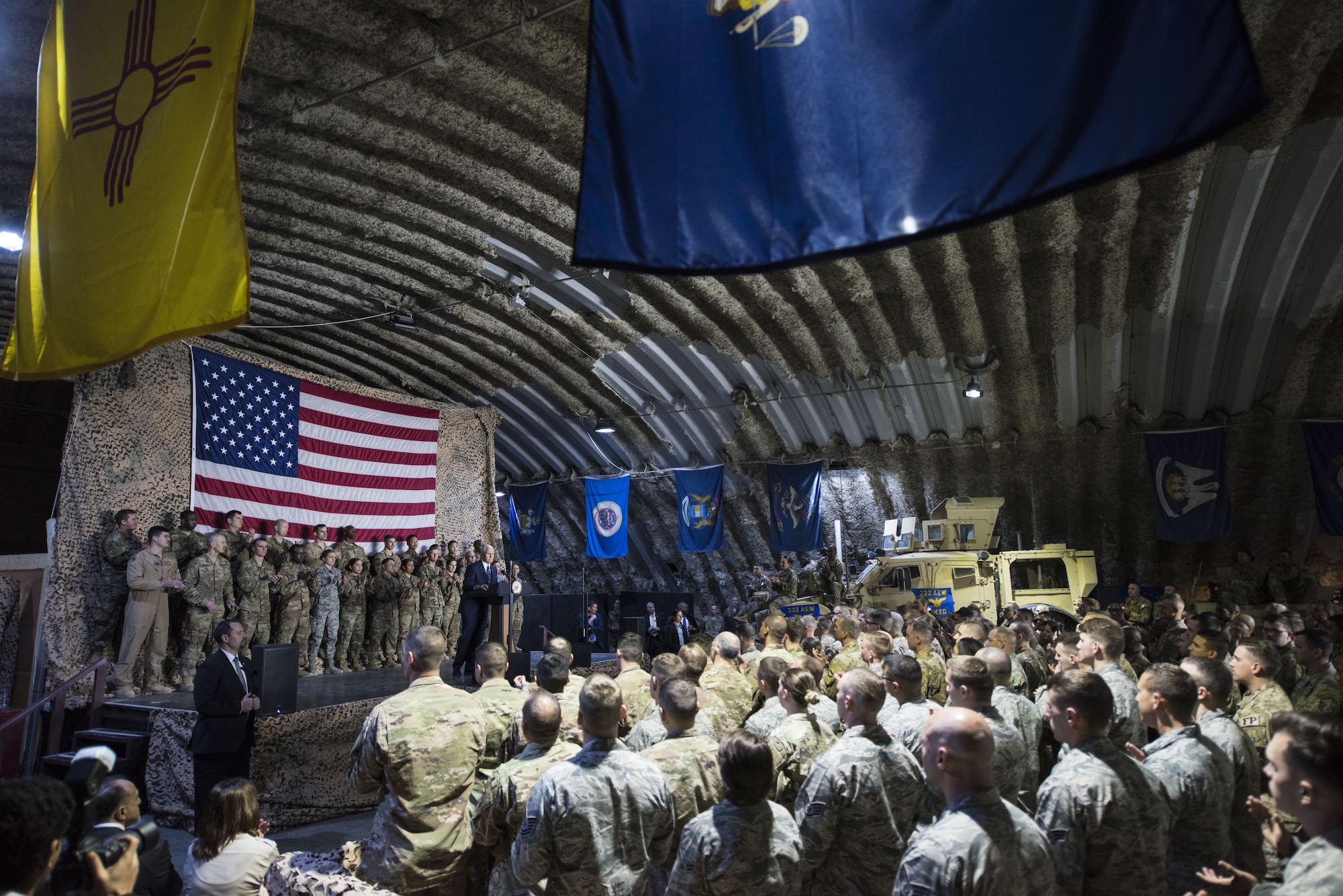 U.S. Vice President Mike Pence speaks to a crowd of deployed service members assigned to the 332d Air Expeditionary Wing January 21, 2018 at an undisclosed location in Southwest Asia. During his speech, Pence praised the wing’s continued dedication to the production of unrivaled airpower and reaffirmed the administration’s efforts to end the current government shutdown. (U.S. Air Force photo by Staff Sgt. Joshua Kleinholz)