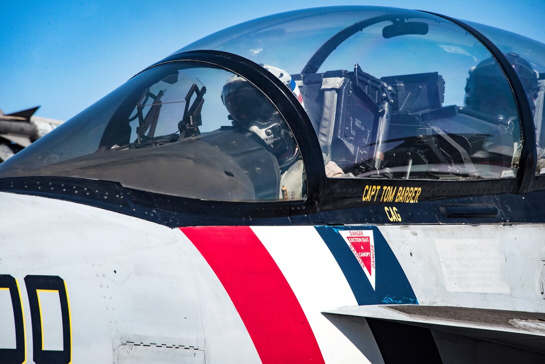 Navy Capt. Tom Barber, commander, Carrier Air Wing 2, and Cmdr. Jason Hutcherson, commander, Strike Fighter Squadron 2, taxi an F/A-18F Super Hornet.