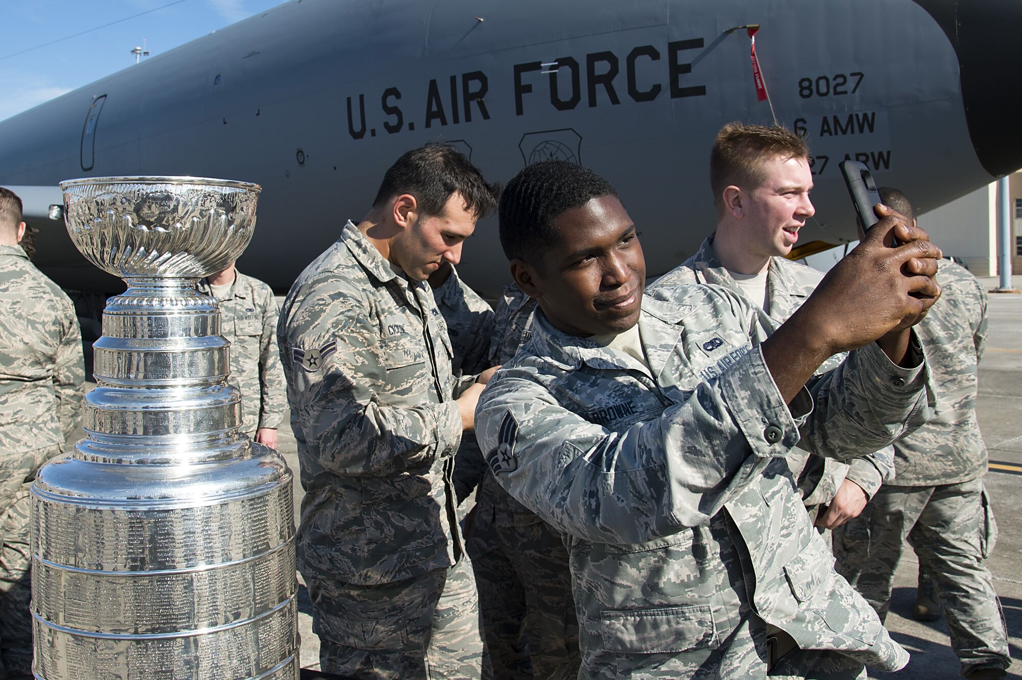 U.S. Air Force Senior Airman Justin Browne, an electrical and environmental systems journeyman assigned to the 6th Maintenance Squadron, takes a photo with the Stanley Cup at MacDill Air Force Base, Fla., Jan. 24, 2018. The Stanley Cup is the oldest trophy competed for by professional athletes, making it a fan favorite for photos.