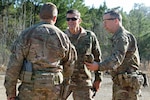Gen. Joseph L. Votel [center], commander of the United States Central Command, greets Col. Scott Jackson [right] and Command Sgt. Maj. Christopher D. Gunn [left], the command team for the 1st Security Force Assistance Brigade at the Joint Readiness Training Center at Fort Polk, La., Jan. 18, 2018. Votel visited for an internal brief prior to 1st SFAB’s upcoming deployment to Afghanistan in the spring of 2018. SFABs are being developed and deployed as a solution to an enduring Army requirement in support of the defense strategy. (U.S. Army photo by Pfc. Zoe Garbarino/Released)