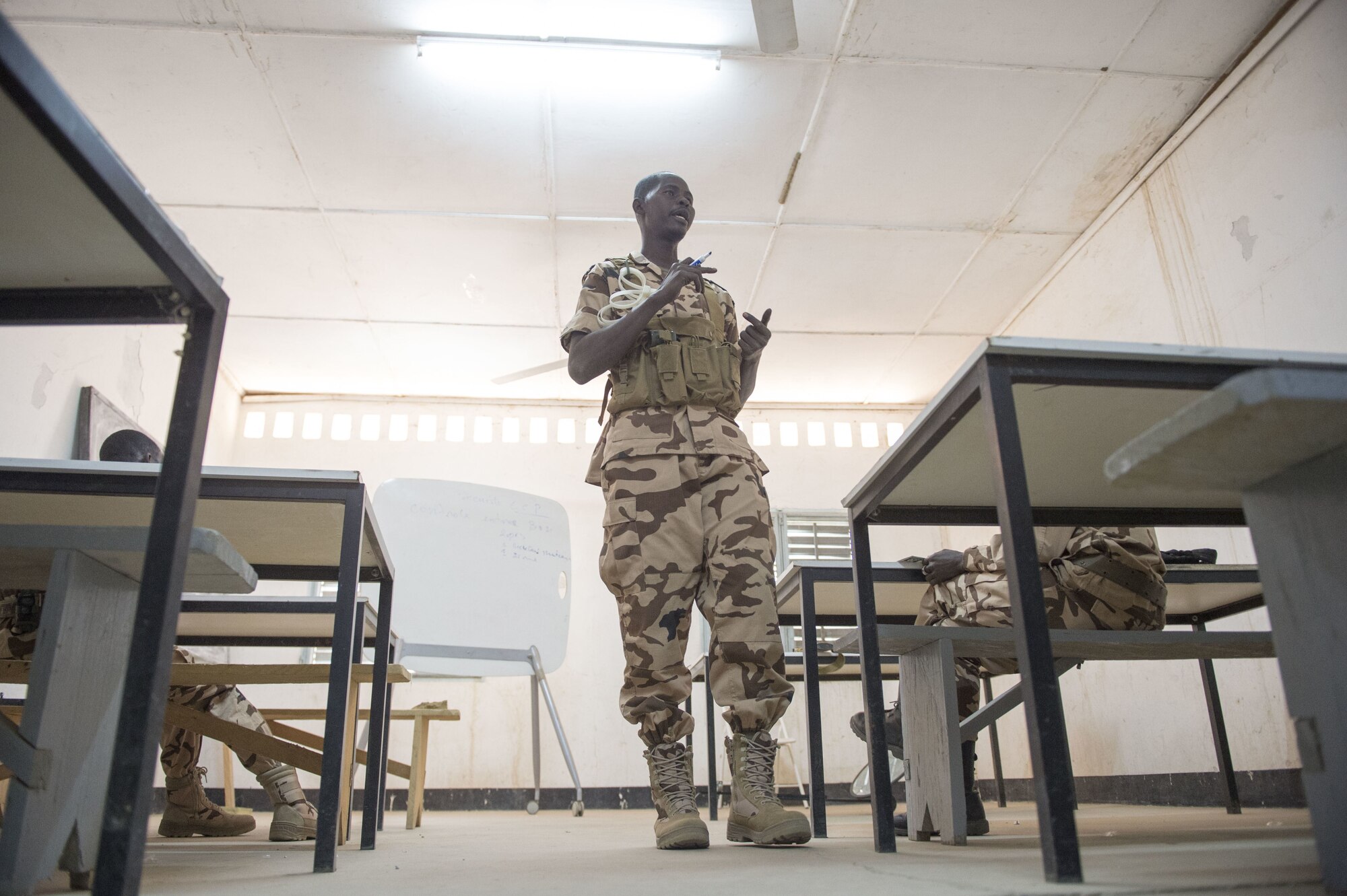 Chadian Air Force Adjudant Chef Issackha Babour, security anti-terrorism student, instructs a class on security procedures during held by the 818th Mobility Support Advisory Squadron as part of a mobile training team event at Adjikossei Air Base, N'Djamena, Chad, January 15, 2018.