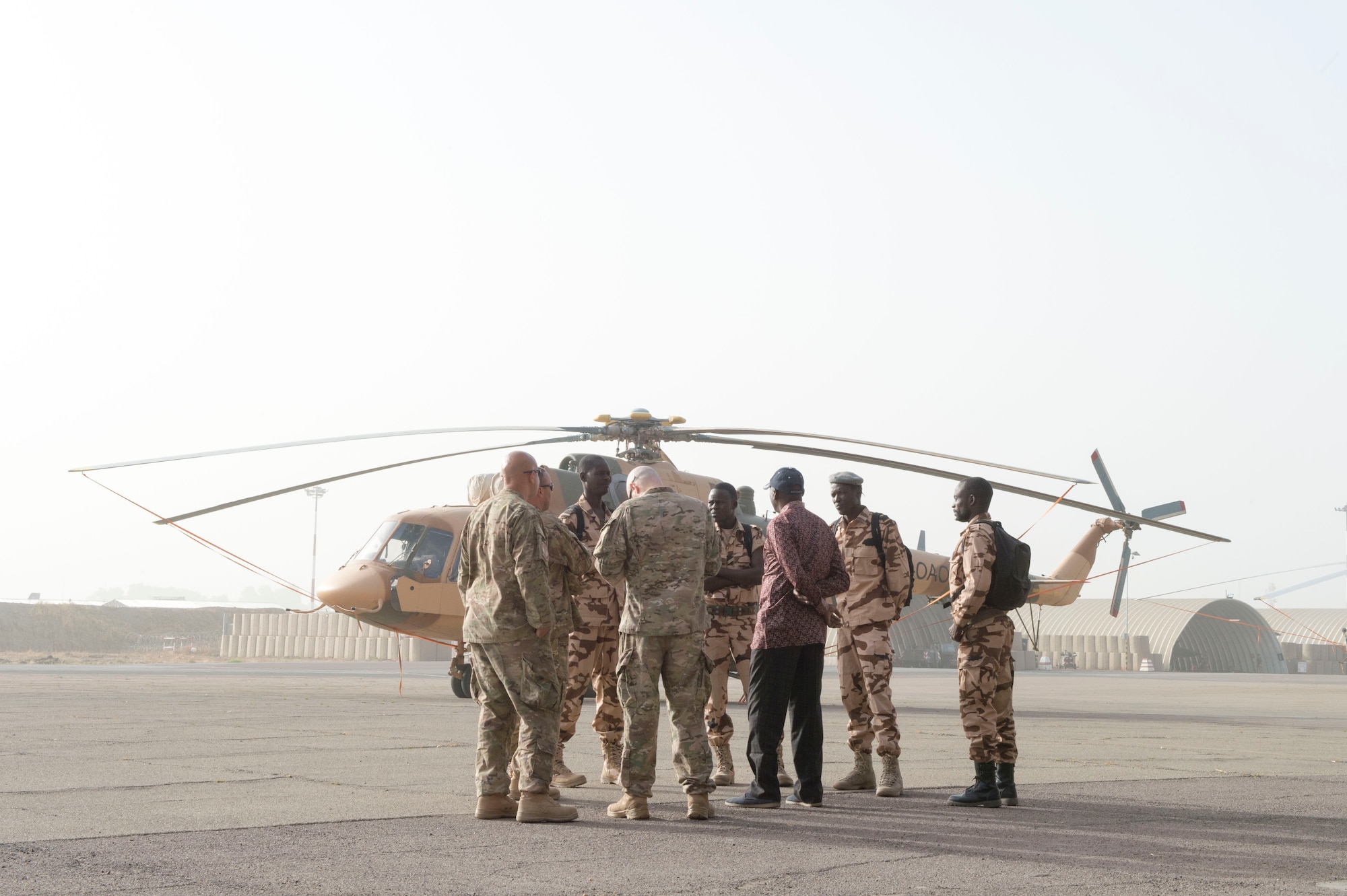 Members of the U.S. Air Force 818th Mobility Support Advisory Squadron go over airfield security procedures with members of the Chadian Air Force Airmen during a mobile training team event at Adjikossei Air Base, N'Djamena, Chad, January 16, 2018.