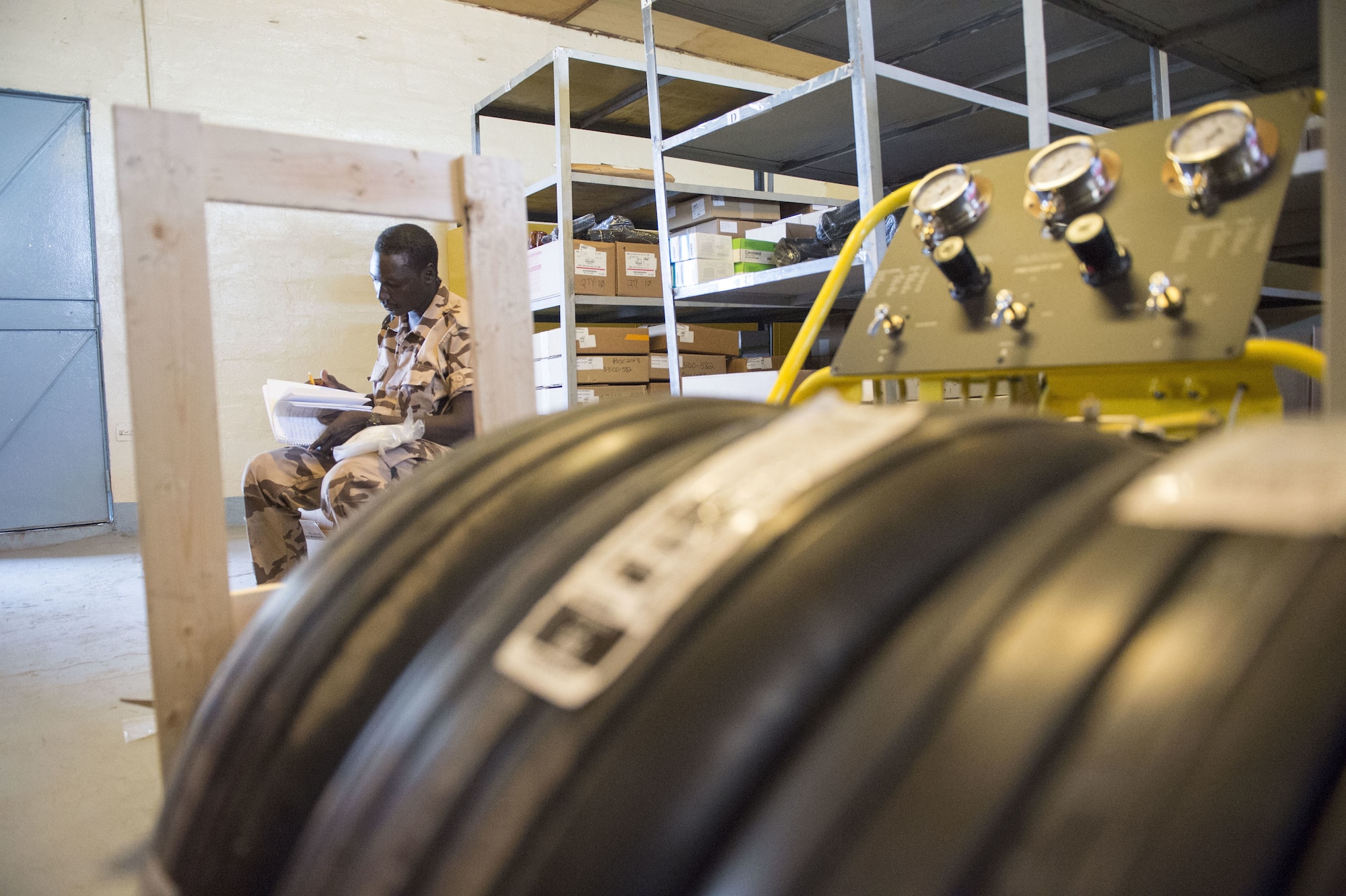 A Chadian Air Force Airman takes accountability of equipment during a training mobility training team event with the 818th Mission Support Advisory Squadron at Adjikossei Air Base, N'Djamena, Chad, January 18, 2018.