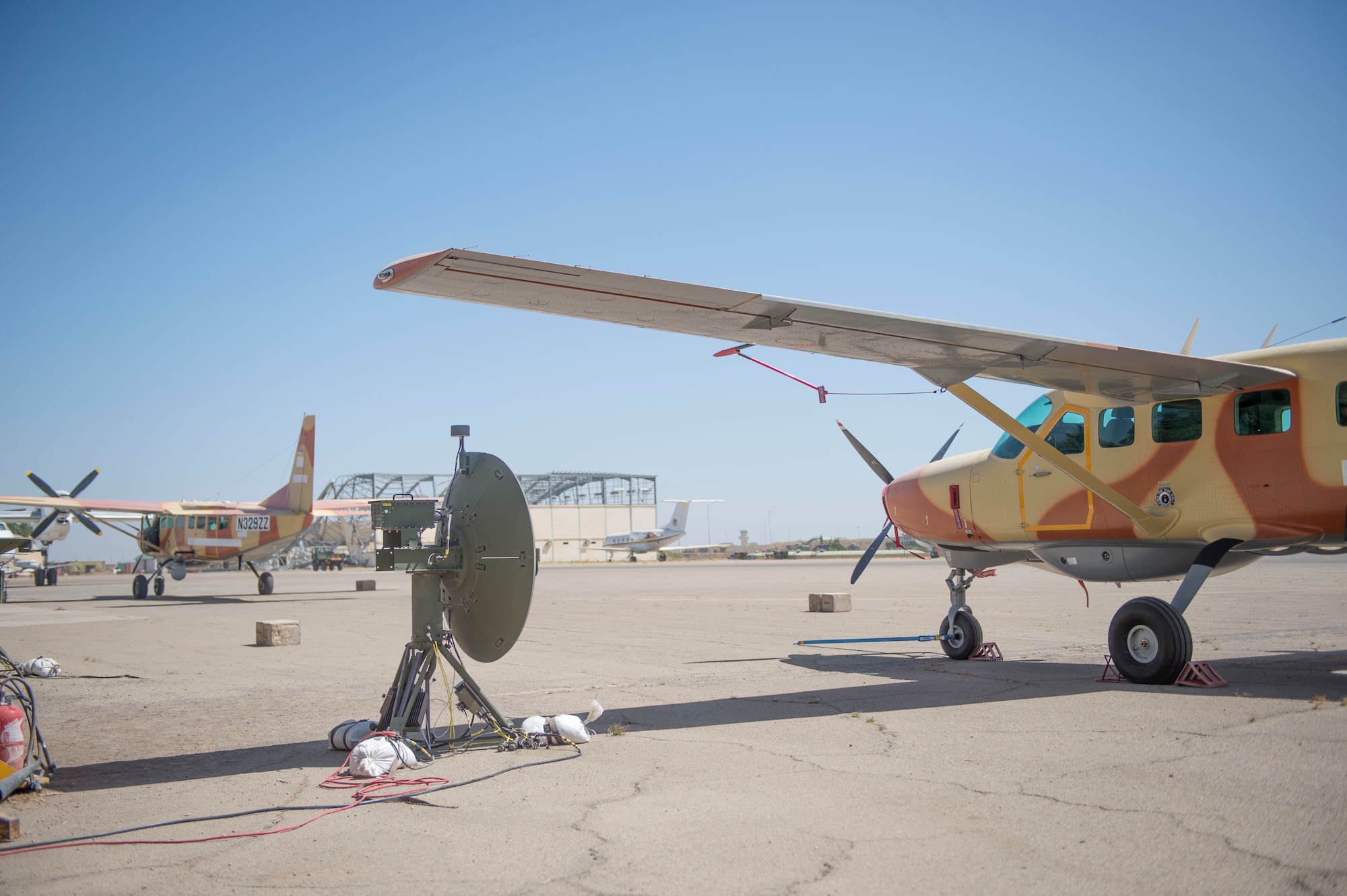 Two C-208 aircraft are parked on the flightline at Adjikossei Air Base, Chad, January 18, 2018.
