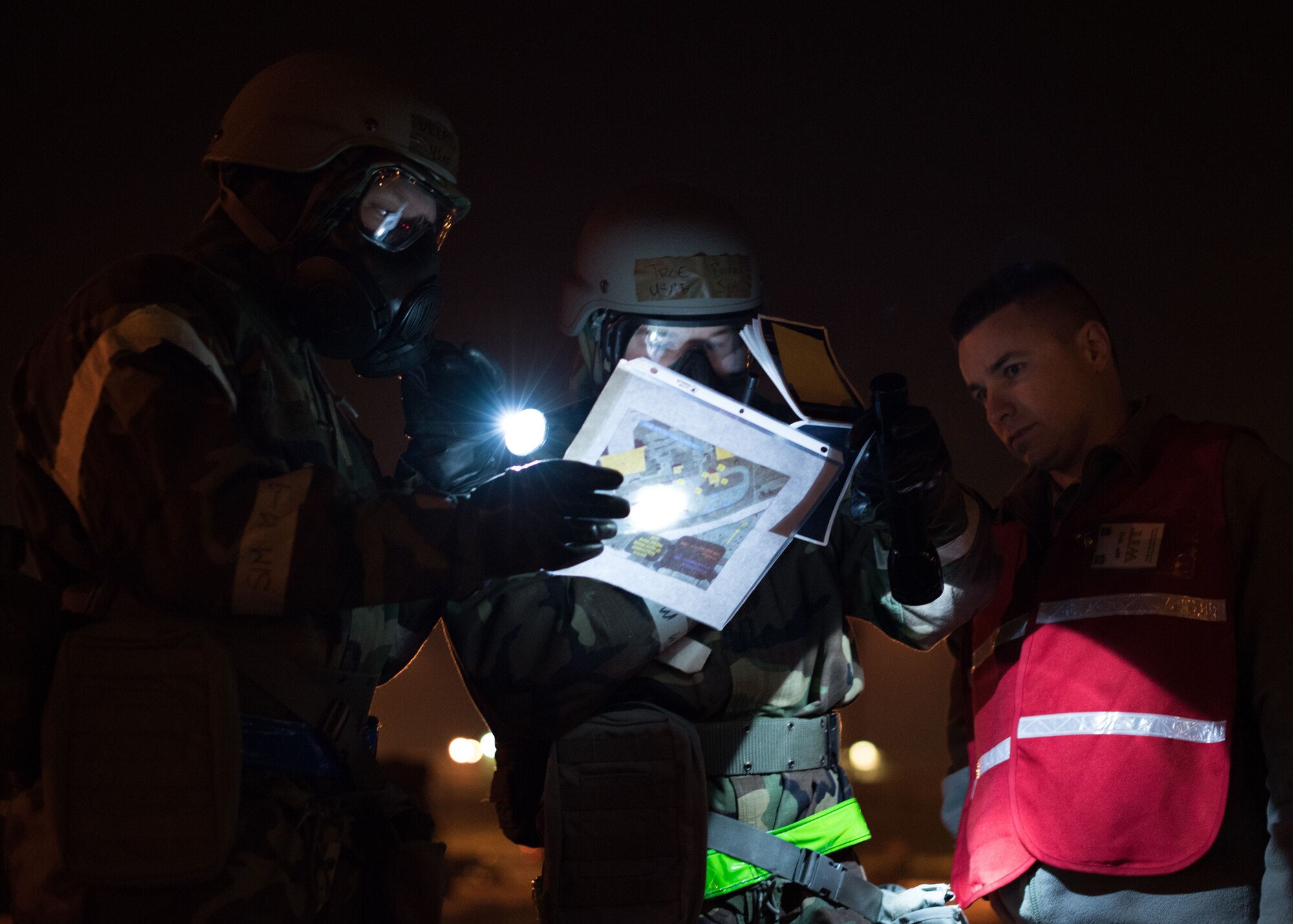 Members of the 55th Wing begin a post attack reconnaissance sweep of the flight line during an operational readiness exercise (ORE) at Offutt Air Force Base, Nebraska, Jan. 23, 2018. OREs are exercises directed at honing combat readiness, and allow Airmen to receive deployment-like experiences at their home station.