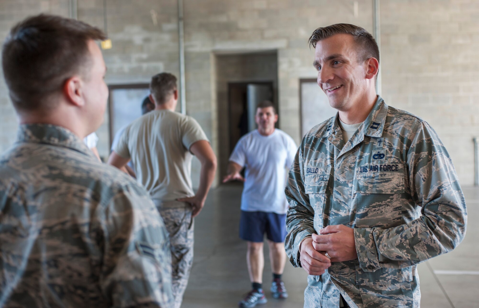 U.S. Air Force Capt. Matthew Gallo, a chaplain assigned to the 6th Air Mobility Wing Chaplain Corps, talks to Airman 1st Class Nathan Meyer, a firefighter assigned to the 6th Civil Engineer Squadron, during his shift at the crash fire station at MacDill Air Force Base, Fla., Jan. 24, 2018.