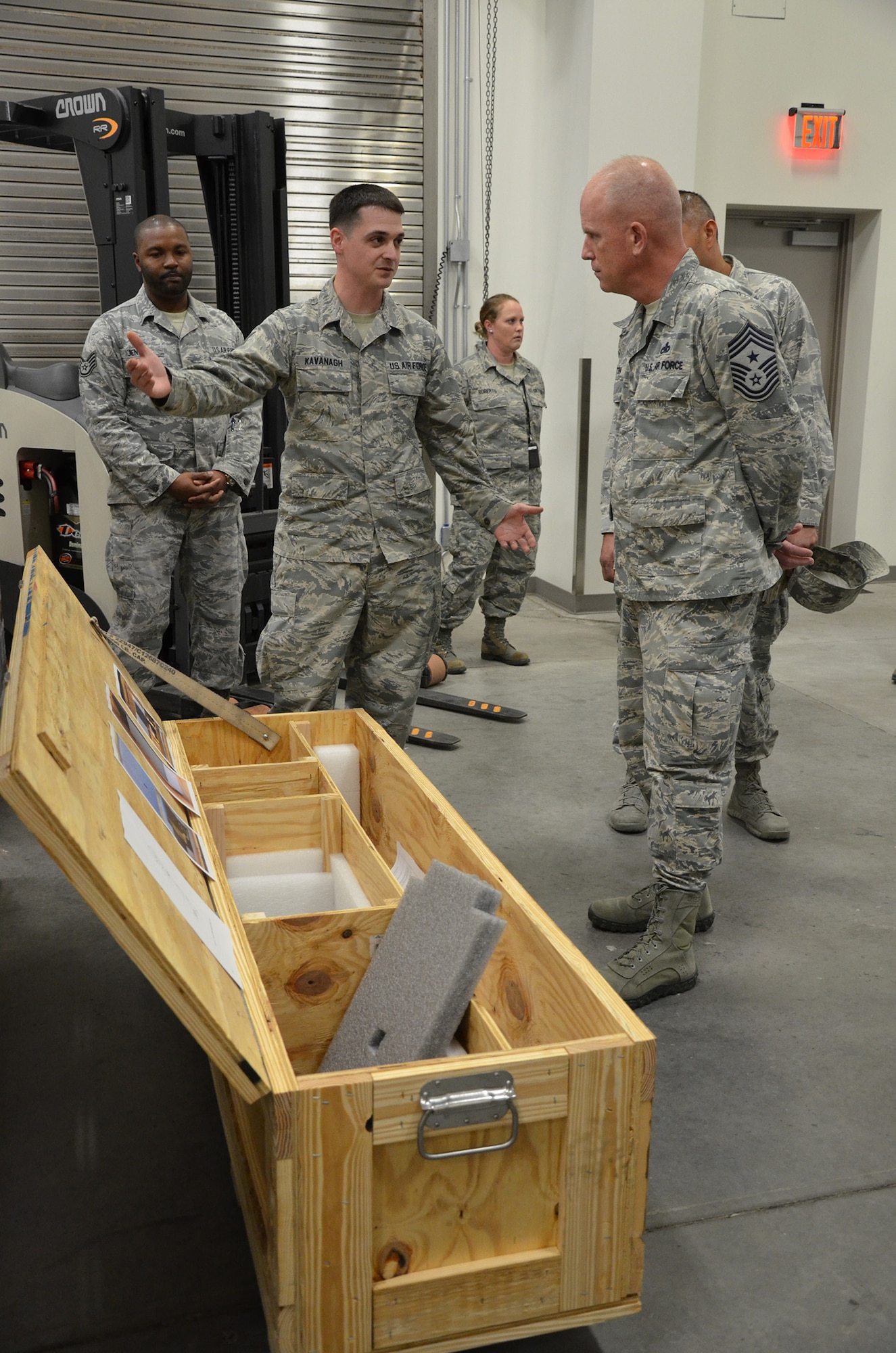 Tech. Sgt. Timothy Kavanagh, noncommissioned officer in charge of product support for the Air Force Technical Applications Center, Patrick AFB, Fla., explains to Chief Master Sgt. Frank Batten, command chief of Air Combat Command, how he designed a crate to better ship, house and store AFTAC's precision seismic equipment.  Batten visited the nuclear treaty monitoring center Jan. 24, 2018 to meet with the Airmen who perform AFTAC's 24/7 global mission. (U.S. Air Force photo by Susan A. Romano)