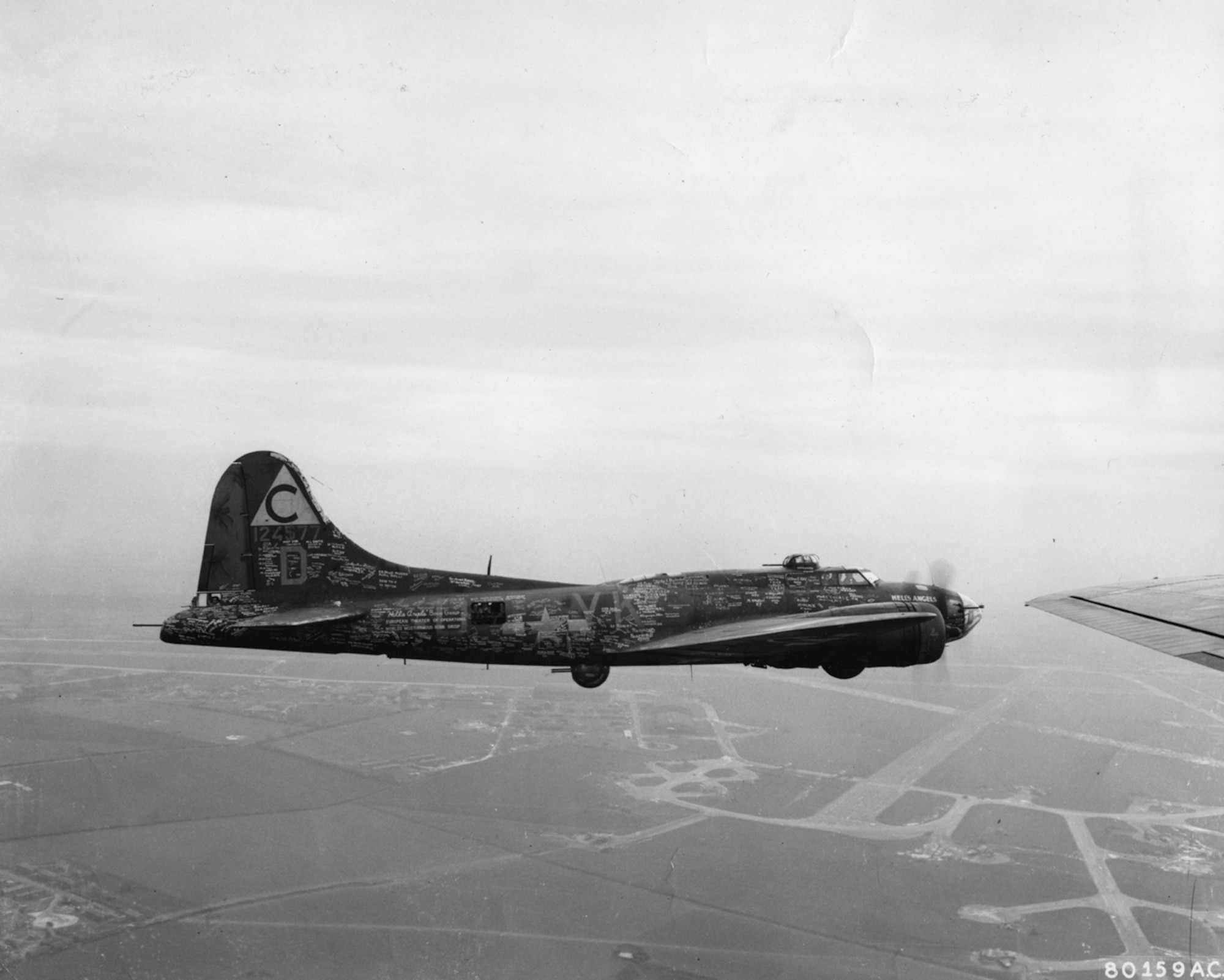 B-17 flying overland in WWII.