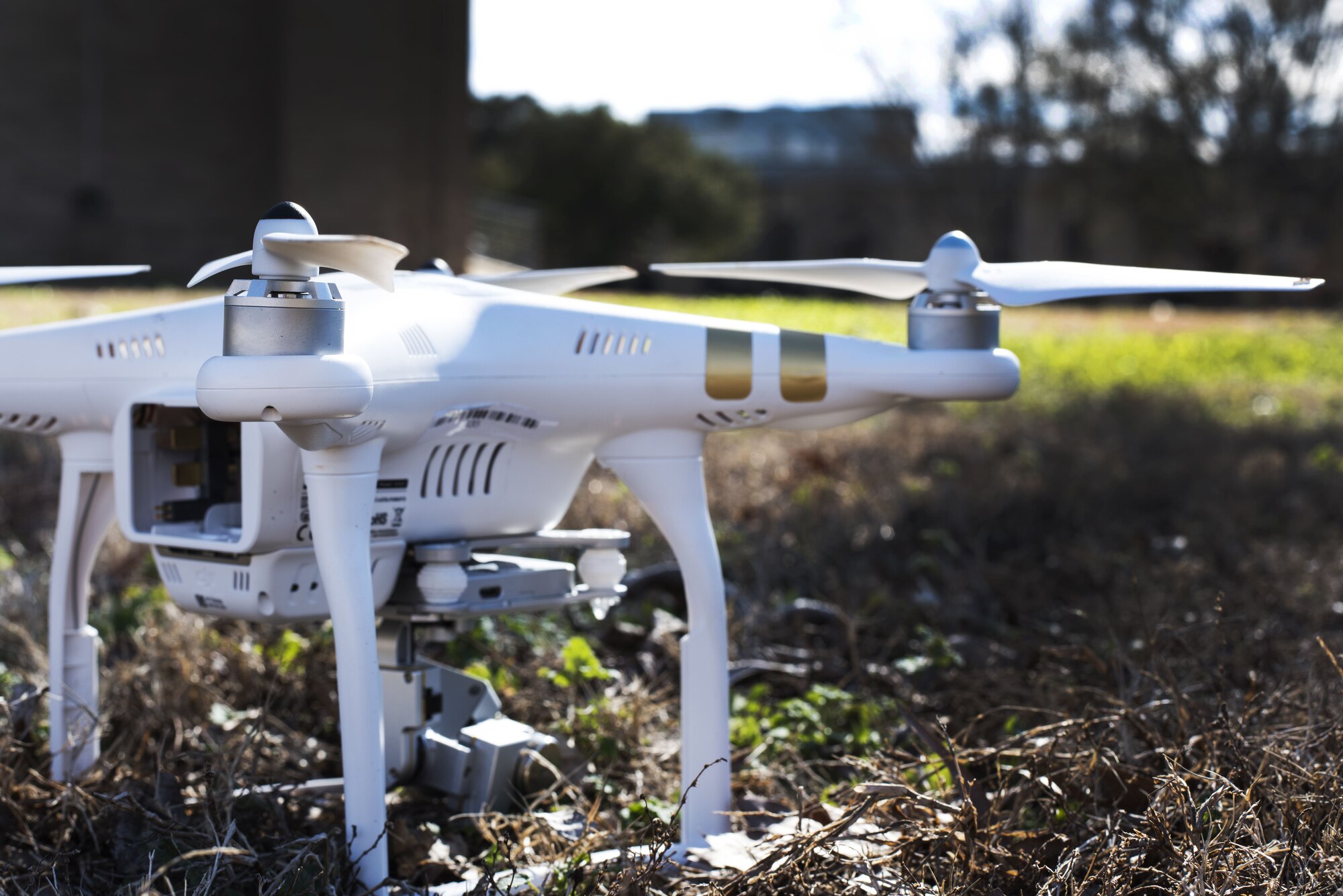 quadcopter is placed on a grassy area.