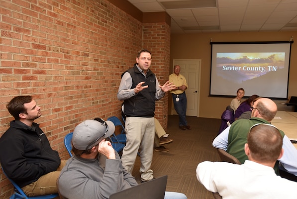 Bryan McCarter, vice mayor of Sevierville, Tenn., welcomes members of Tennessee Silver Jackets to the city's emergency management center Jan. 25, 2018. The Silver Jackets team received a briefing on the wildfires that moved through Sevier County and city of Gatlinburg in November 2016. Silver Jackets is an innovative partnership where local, state and federal agencies facilitate flood risk reduction, coordinates programs, promotes cohesive solutions, synchronizes plans and policies, and ultimately provides integrated solutions. (USACE photo by Lee Roberts)