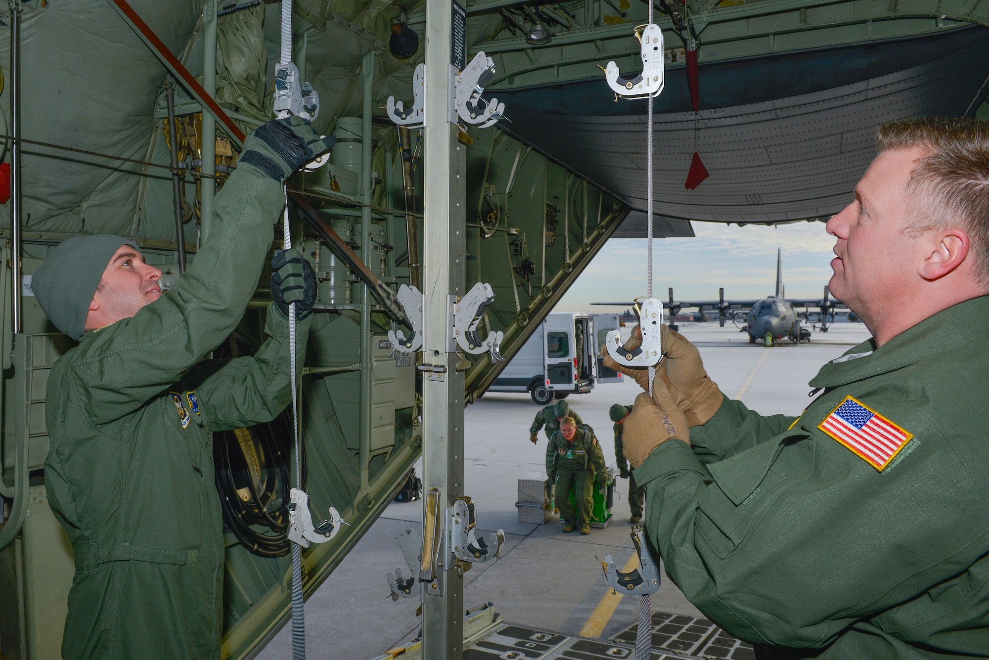 Tech. Sgt. Jesse Guest and Master Sgt. Zak Johnson reserve aeromedical technicians with the 934th Aeromedical Evacuation Squadron, prepare the inside of a C-130 to hold patient litters for an aeromedical evacuation training mission at the Minneapolis-St. Paul Air Reserve Station, Minn., on Jan. 8, 2018. The trainer missions help members of the AES maintain their currency and hone their skills in preparation for any future deployments or contingencies. (U.S. Air Force photo by Master Sgt. Eric Amidon)