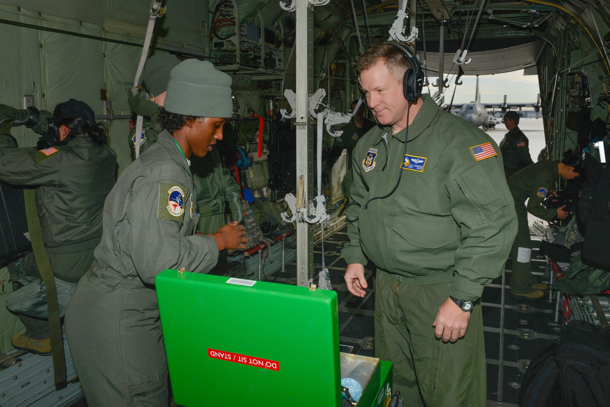 Master Sgt. Zak Johnson, a reserve aeromedical technician with the 934th Aeromedical Evacuation Squadron inspects Senior Airman Fardosa Anahata as she prepares her equipment for a trainer mission at the Minneapolis-St. Paul Air Reserve Station, Minn., on Jan. 8, 2018. The trainer missions are set up with scenarios and patient simulations that help prepare medical technicians for in-flight emergencies as well as any emergencies that may occur prior to or after aeromedical evacuations. (U.S. Air Force photo by Master Sgt. Eric Amidon)