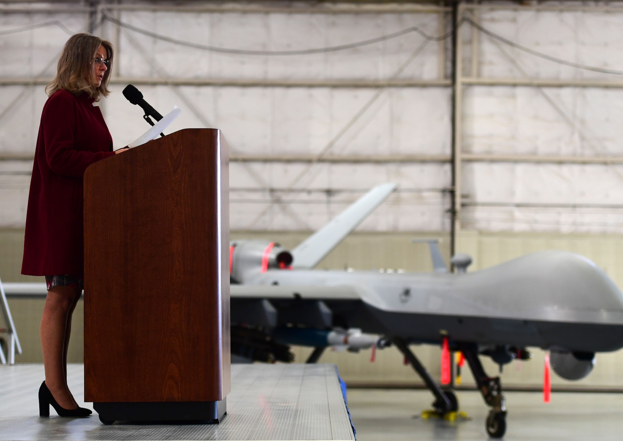 Ms. Jonna Doolittle Hoppes, executive director of the Doolittle Foundation and granddaughter of Gen. James “Jimmy” Doolittle, speaks to the men and women of the 432nd Wing/432nd Air Expeditionary Wing Jan. 18, 2018, at Creech Air Force Base, Nev. Doolittle Hoppes and retired Lt. Gen. Christopher Miller, president of the Air Force Historical Foundation, presented the General James H. “Jimmy” Doolittle award to the 432nd Wing/432nd Air Expeditionary Wing for making a significant impact to Air Force history. (U.S. Air Force photo/Senior Airman Christian Clausen)