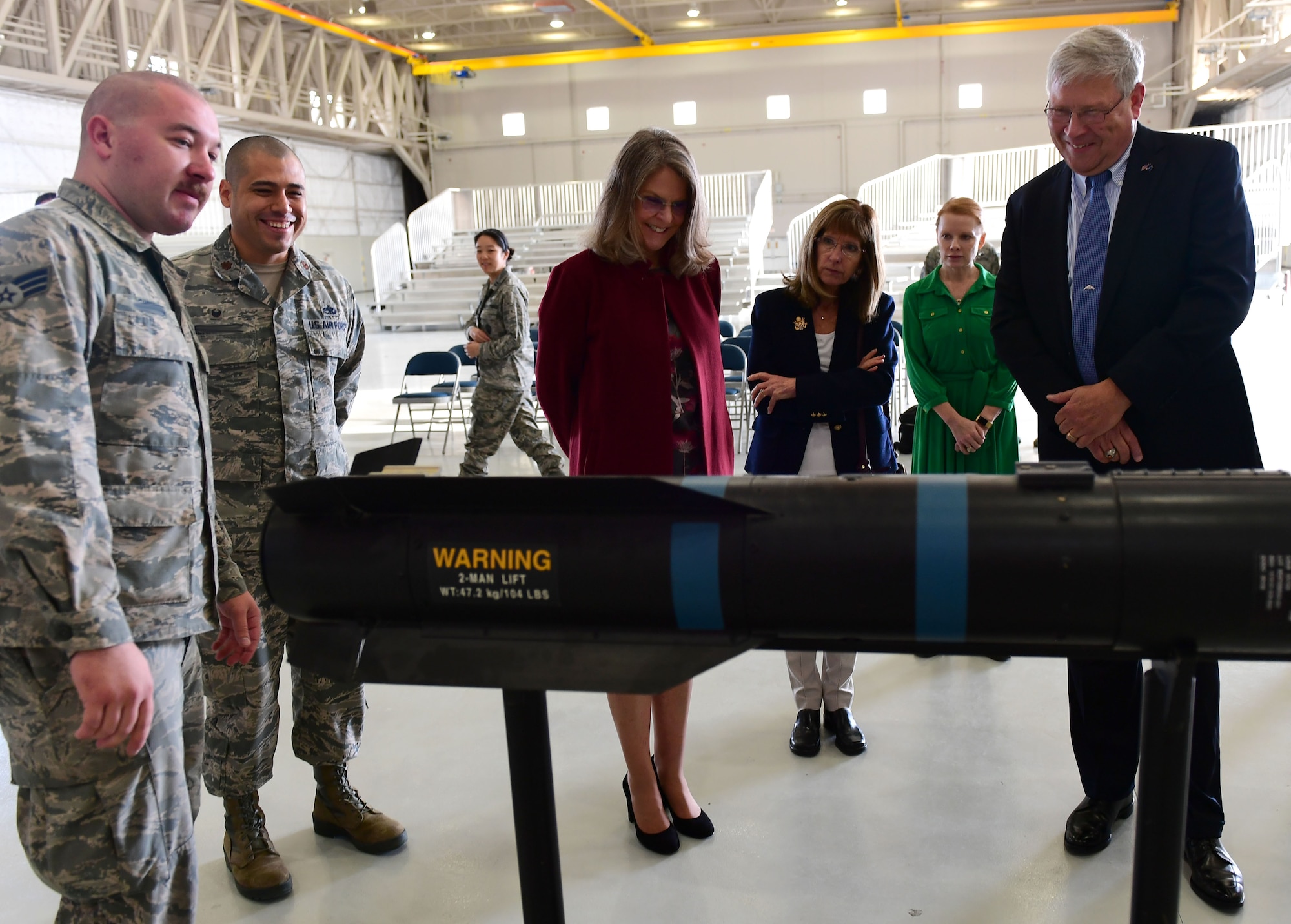 Ms. Jonna Doolittle Hoppes, executive director of the Doolittle Foundation and granddaughter of Gen. James “Jimmy” Doolittle, and retired Lt. Gen. Christopher Miller, president of the Air Force Historical Foundation, look at the inner workings of an AGM-114 Hellfire missile Jan. 18, 2018. During their visit, Doolittle Hoppes and Miller received an in depth look at the Remotely Piloted Aircraft mission before presenting the General James H. “Jimmy” Doolittle award to the 432nd Wing/432nd Air Expeditionary Wing. (U.S. Air Force photo/Senior Airman Christian Clausen)