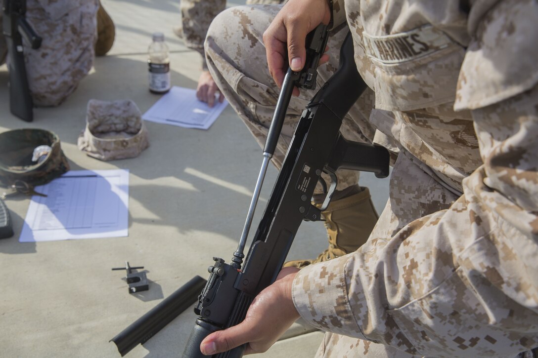 A Marine with Task Force Al-Taqaddum 18.1 Rotation 6 assembles an AK-47 assault rifle as part of a foreign weapons demonstration at Marine Corps Base Camp Pendleton, California, Jan. 16, 2018.
