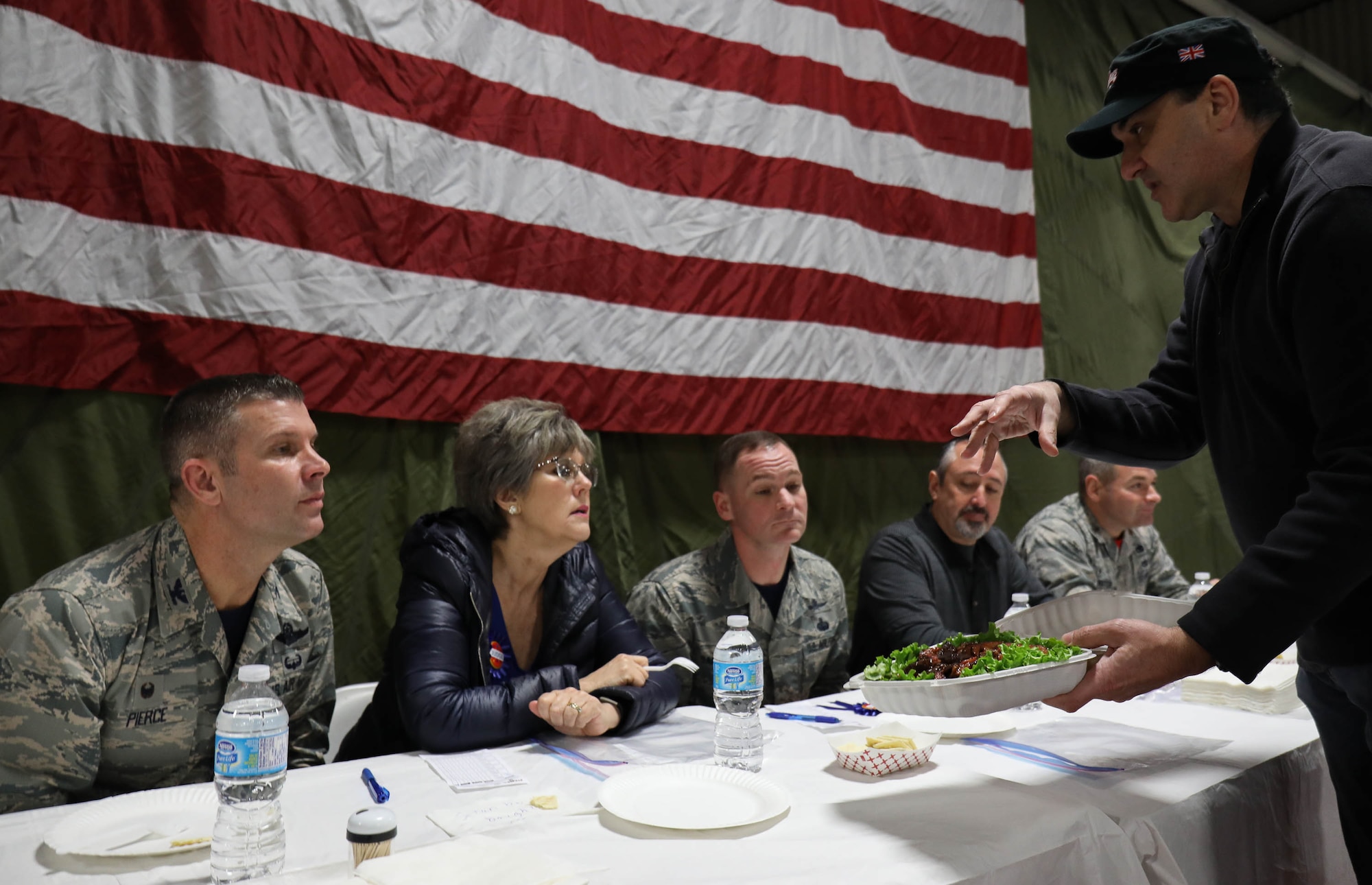 Commander of the 446th AW Col. Sean Pierce, along with other senior leadership, judges barbecue prepared by members of the 62nd and 446th Airlift Wings Jan. 19, 2018, on Joint Base Lewis-McChord. Members of both wings were paired with Washington State pitmasters and food was served for free to personnel assigned to JBLM.