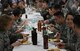 Airmen of the 62nd and 446th Airlift Wings participate in Diversity Day, an event that celebrated cultural differences between service members Jan. 19, 2018, on Joint Base Lewis-McChord. Barbecue prepared by Washington State pitmasters, paired with members of both wings, was served free of charge.