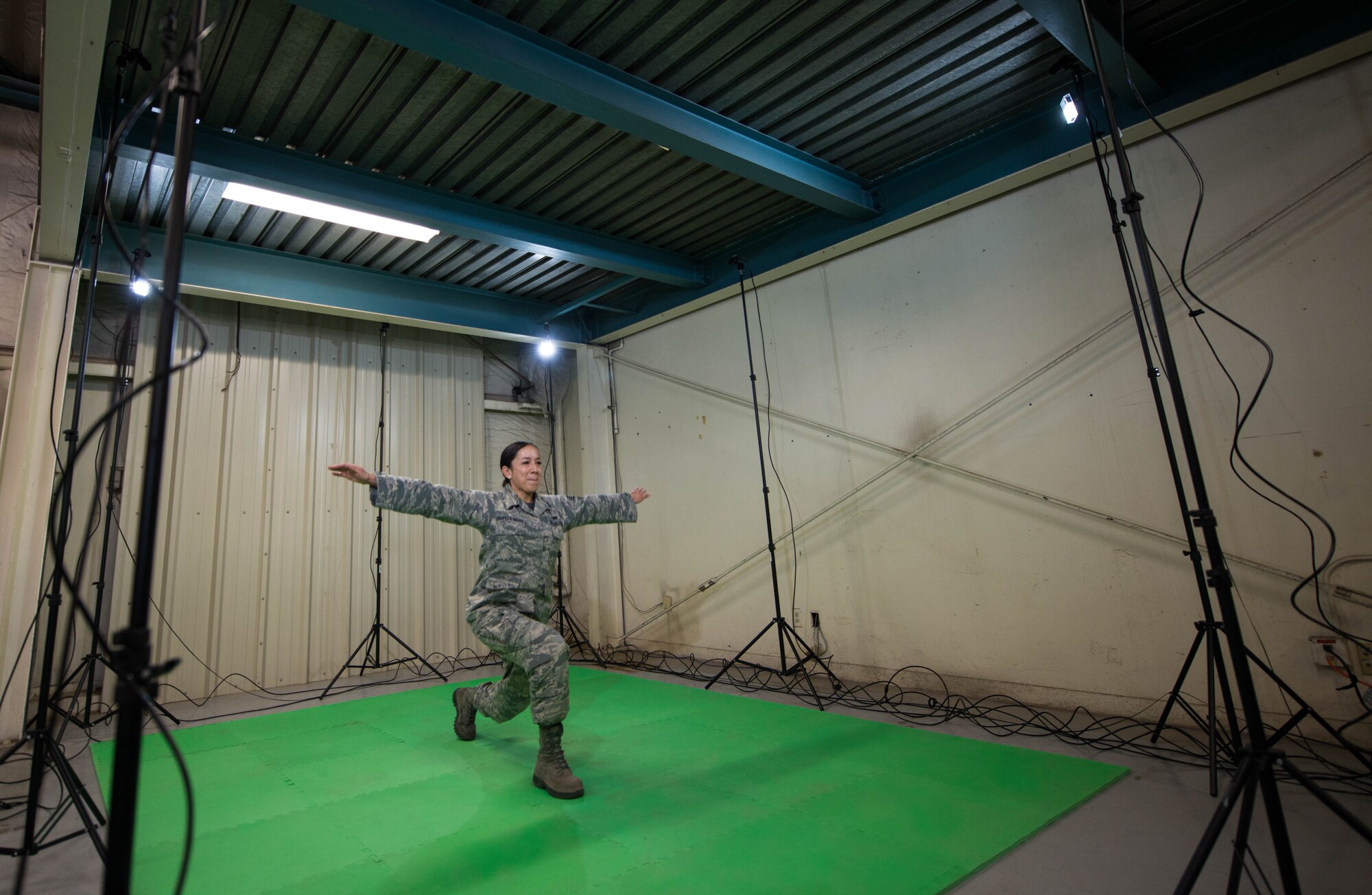 Staff Sgt. Jennifer Oropeza-Magee, 56th Aerospace Medical Squadron flight medical technician, performs movements during a Dynamic Athletic Research Institute assessment at Luke Air Force Base, Ariz., Jan. 26, 2018. The assessment was conducted using the DARI marker-less motion analytics machine, an eight camera system designed to pinpoint weak muscle groups and predict which areas of the body are most prone to injury. (U.S. Air Force photo/Airman 1st Class Alexander Cook)