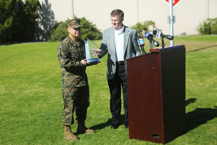 Vuong saved the life of a UPS driver by using his Marine training to remove him from his wrecked truck. Vuong waited with the driver until emergency medical personnel arrived.