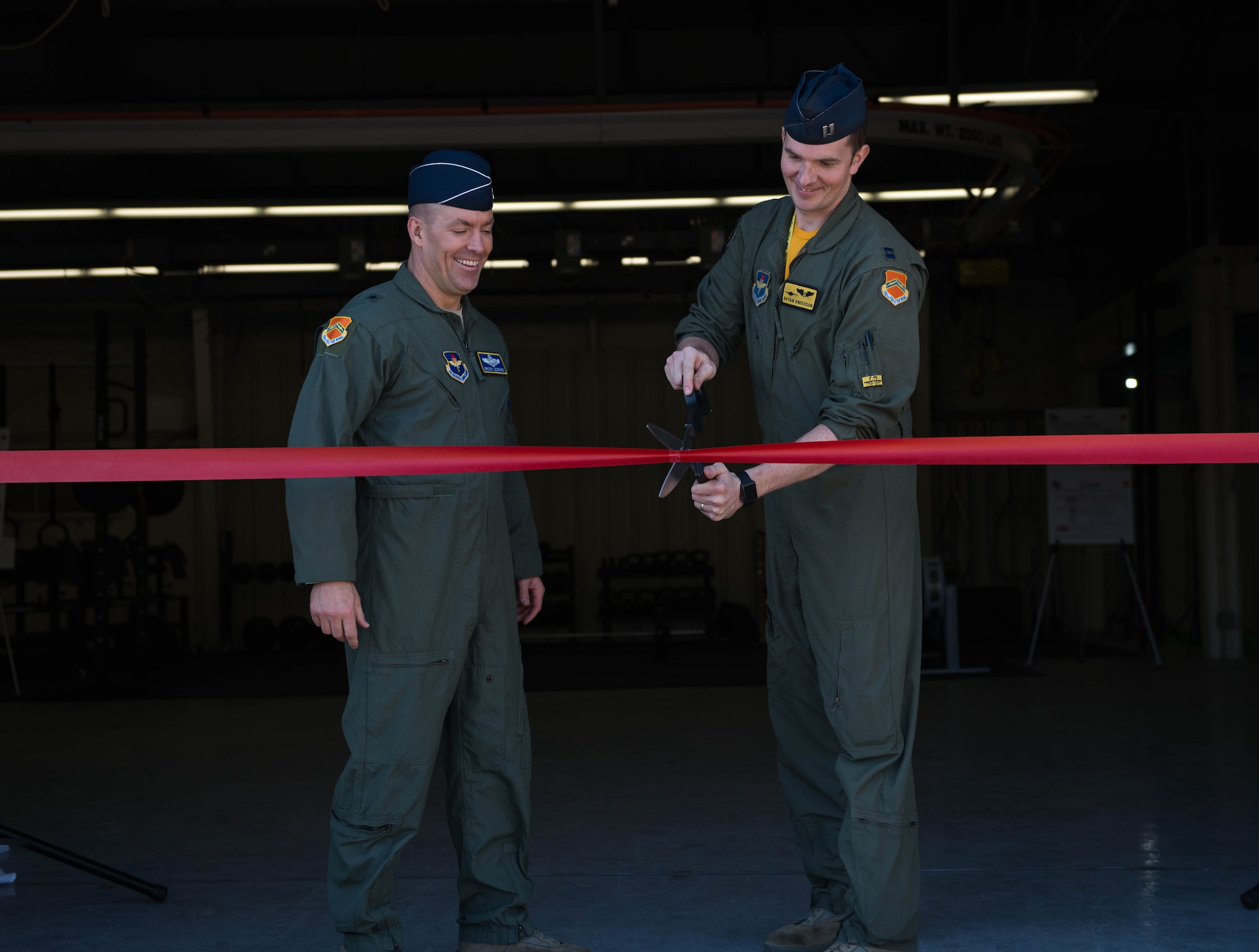 Brig. Gen. Brook Leonard, 56th Fighter Wing commander and Capt. Bryan Anderson, 56th Medical Group flight surgeon, cut the ribbon to the Aviator Center of Excellence at Luke Air Force Base, Ariz., Jan. 26, 2018. The ACE is a new, high-performance athletic training facility for pilots offering one-on-one coaching, individualized fitness plans and fitness equipment. (U.S. Air Force photo/Airman 1st Class Alexander Cook)
