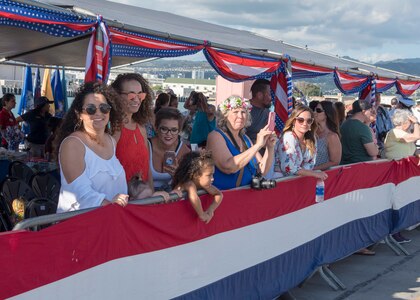 180126-N-KV911-0051 PEARL HARBOR (Jan. 26, 2018) Family members wait for their loved ones from the Virginia-class fast-attack submarine USS Missouri (SSN 780) to arrive at Joint Base Pearl Harbor-Hickam following a change of homeport from Groton, Connecticut, Jan. 26. USS Missouri is the 6th Virginia-class submarine homeported in Pearl Harbor. (U.S. Navy Photo by Mass Communication Specialist 2nd Class Shaun Griffin/Released)