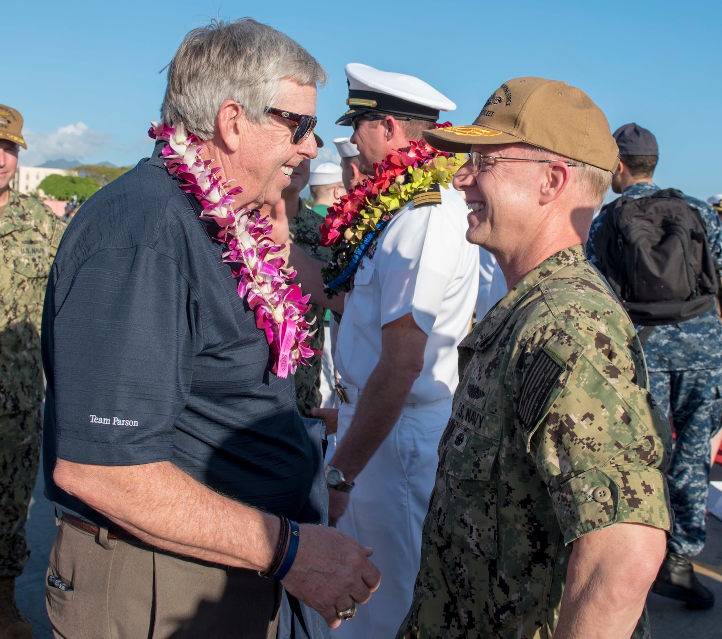 180126-N-KV911-0166 PEARL HARBOR (Jan. 26, 2018) Missouri Lieutenant Governor Michael L. Parson speaks with Rear Adm. Daryl Caudle, commander, Submarine Force, U.S. Pacific Fleet following the Virginia-class fast-attack submarine USS Missouri (SSN 780) arrival at Joint Base Pearl Harbor-Hickam following a change of homeport from Groton, Connecticut, Jan. 26. USS Missouri is the 6th Virginia-class submarine homeported in Pearl Harbor. (U.S. Navy Photo by Mass Communication Specialist 2nd Class Shaun Griffin/Released)