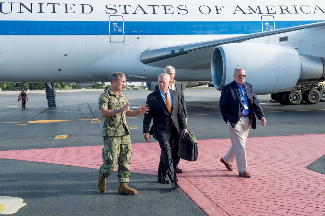 Defense Secretary James N. Mattis walks along the tarmac after arriving in Hawaii.