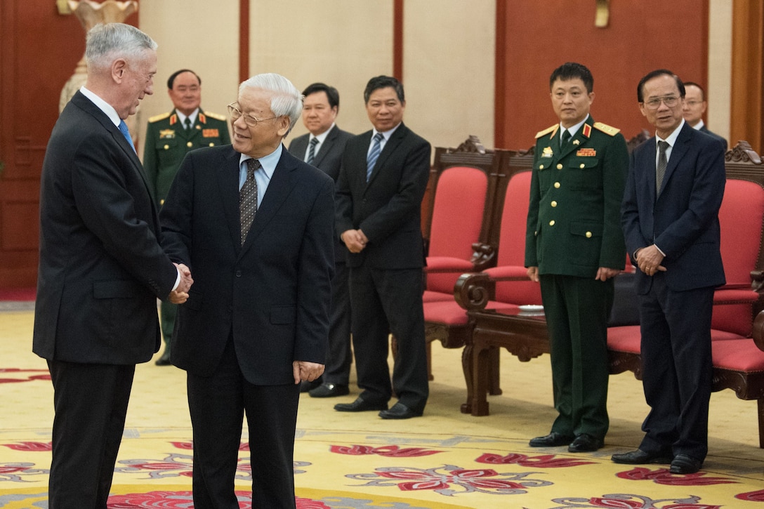 Defense Secretary James N. Mattis shakes hands with the Communist Party General Secretary.