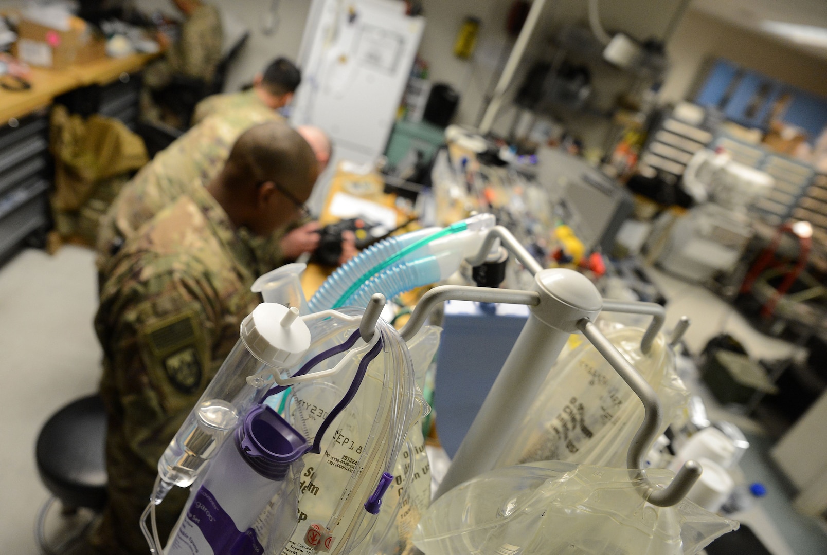 Members of the 455th Expeditionary Medical Operation Squadron clinical engineering team repair medical equipment Jan. 15, 2018 at Craig Joint Theater Hospital in Bagram Airfield, Afghanistan.