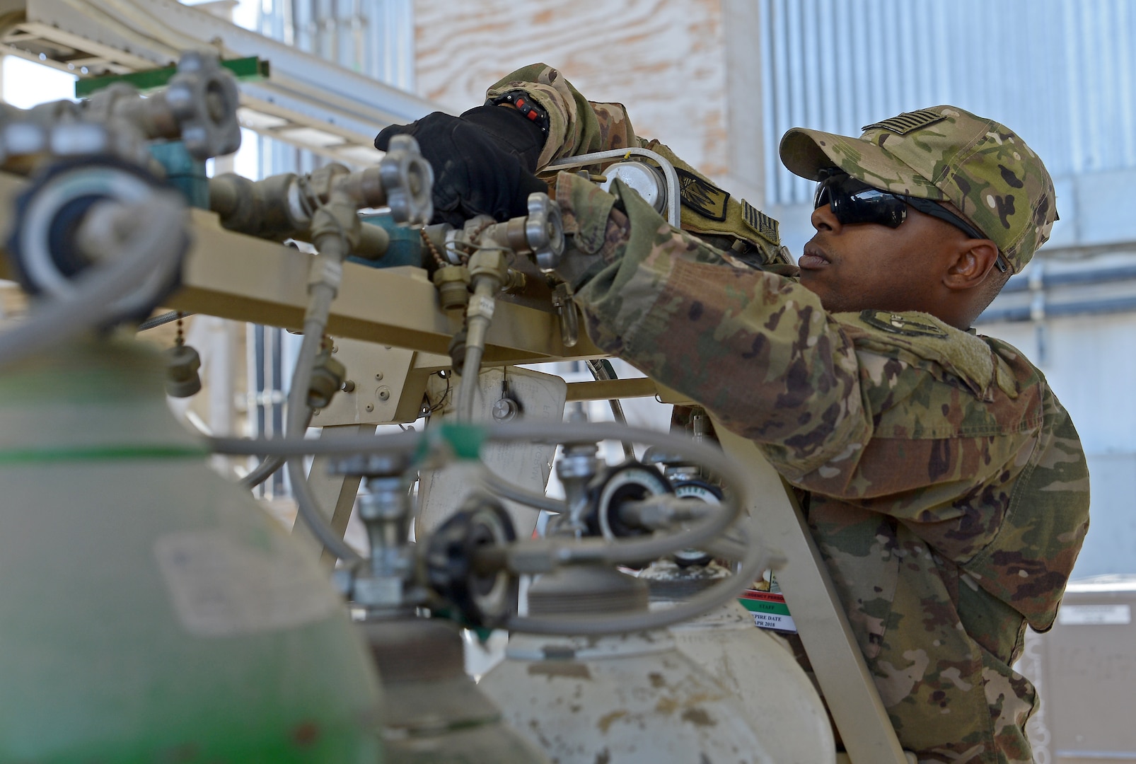 Tech. Sgt. Richard Smith, 455th Expeditionary Medical Operation Squadron clinical engineering NCOIC, checks an oxygen tank Jan. 15, 2018 at Craig Joint Theater Hospital in Bagram Airfield, Afghanistan.