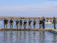 Marines with 9th Marine Corps District participate in the MWR Polar Bear Plunge at Naval Station Great Lakes, Ill., Jan. 27. Around the world, thrill seekers participate in the Polar Bear Plunge, which consist of jumping into freezing water. . (Photo by U.S. Marine Cpl. Quavaungh Pointer)