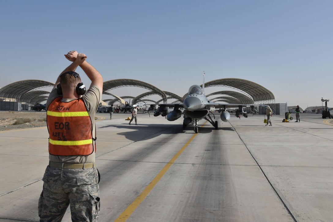407th Expeditionary Maintenance Squadron crewmembers prepare for the final check on an F-16 Fighting Falcon before a mission from an undisclosed location in Southwest Asia, Jan. 18, 2018. This check took place on the last day the 100th EFS flew missions. (U.S. Air Force photo by Staff Sgt. Joshua Edwards/Released)