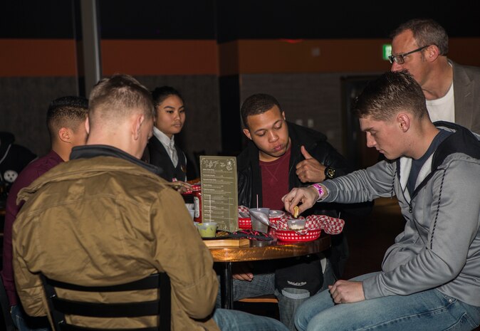 Marine Corps Community Services (MCCS) welcomed enlisted U.S. Marines and Sailors, grades E-5 and below, to celebrate the grand opening of the Hangar E-Club at Marine Corps Air Station Iwakuni, Japan, Jan. 26, 2018.