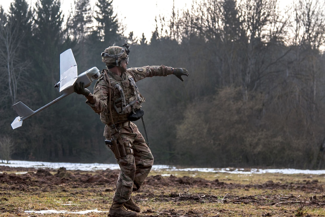 Army Spc. William Ritter launches an RQ-11 Raven, small unmanned aerial system, during Allied Spirit VIII at Hohenfels Training Area, Germany.